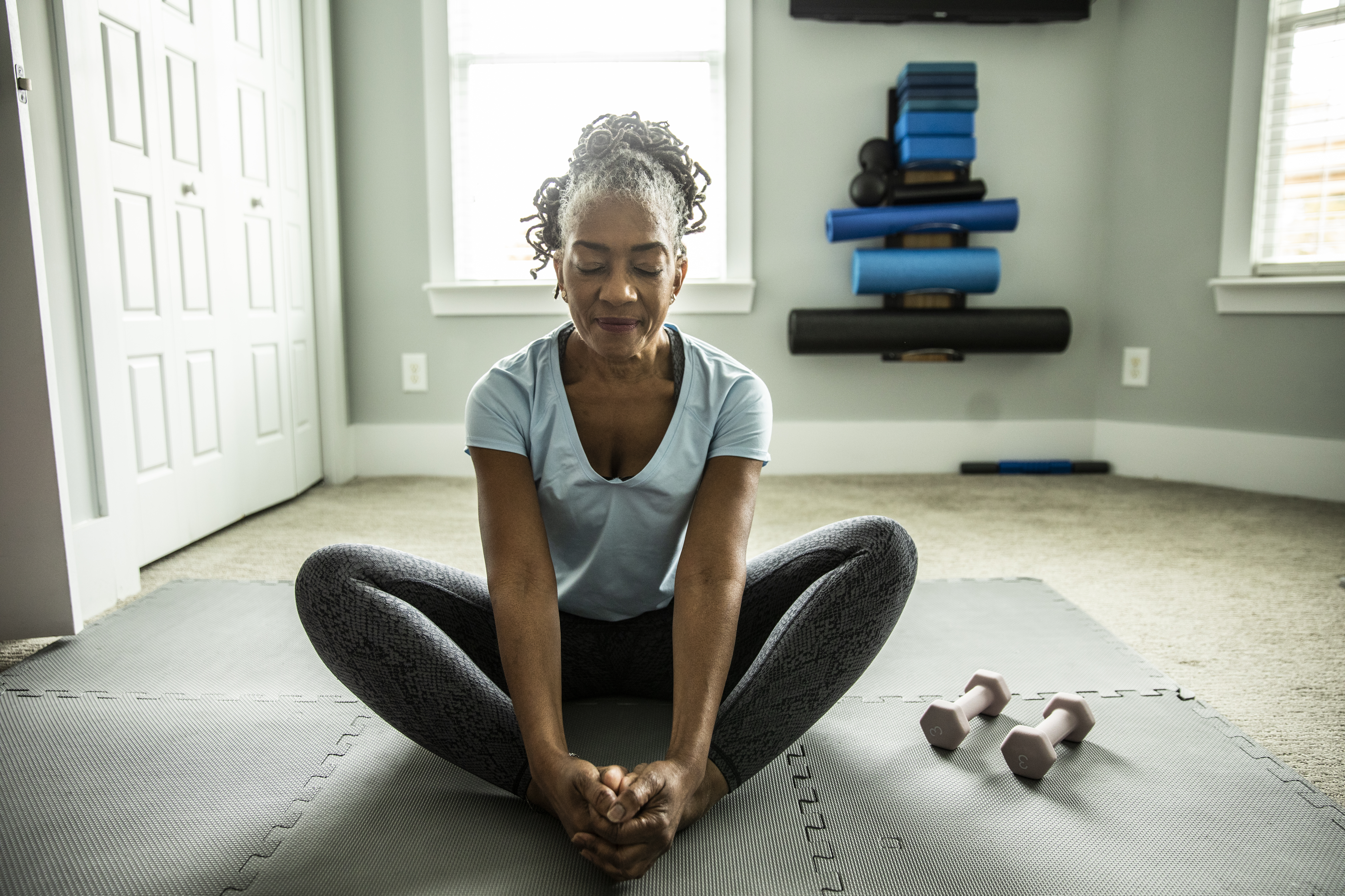 Woman stretching at home - Decorative